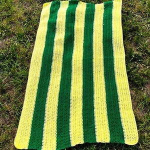 Crocheted yellow and green towel